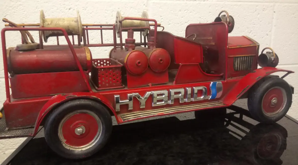Red vintage fire truck model with "HYBRID".